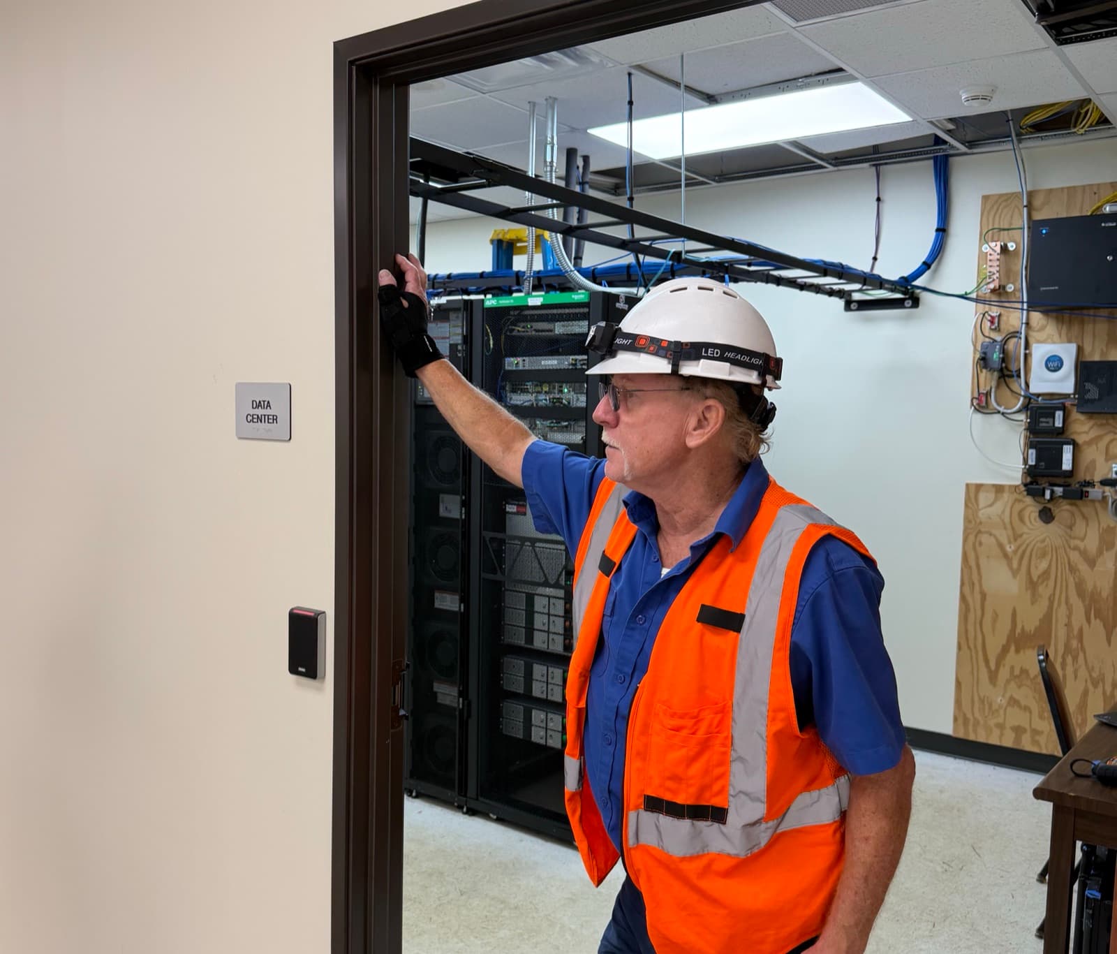Comp-Utility technician inspecting a data center